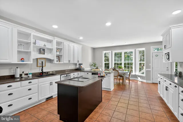 a bedroom with furniture and a large window