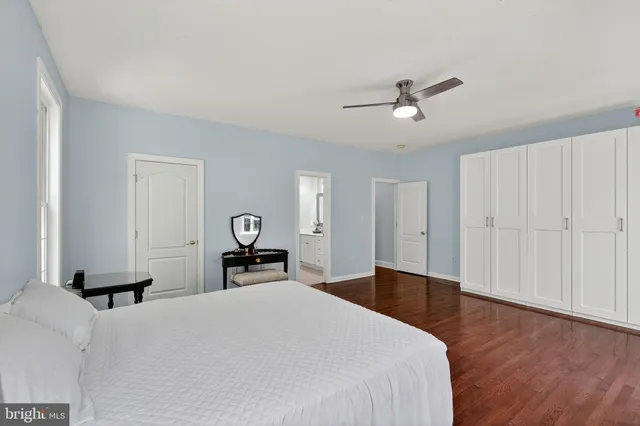an aerial view of a house with garden space and a lake view