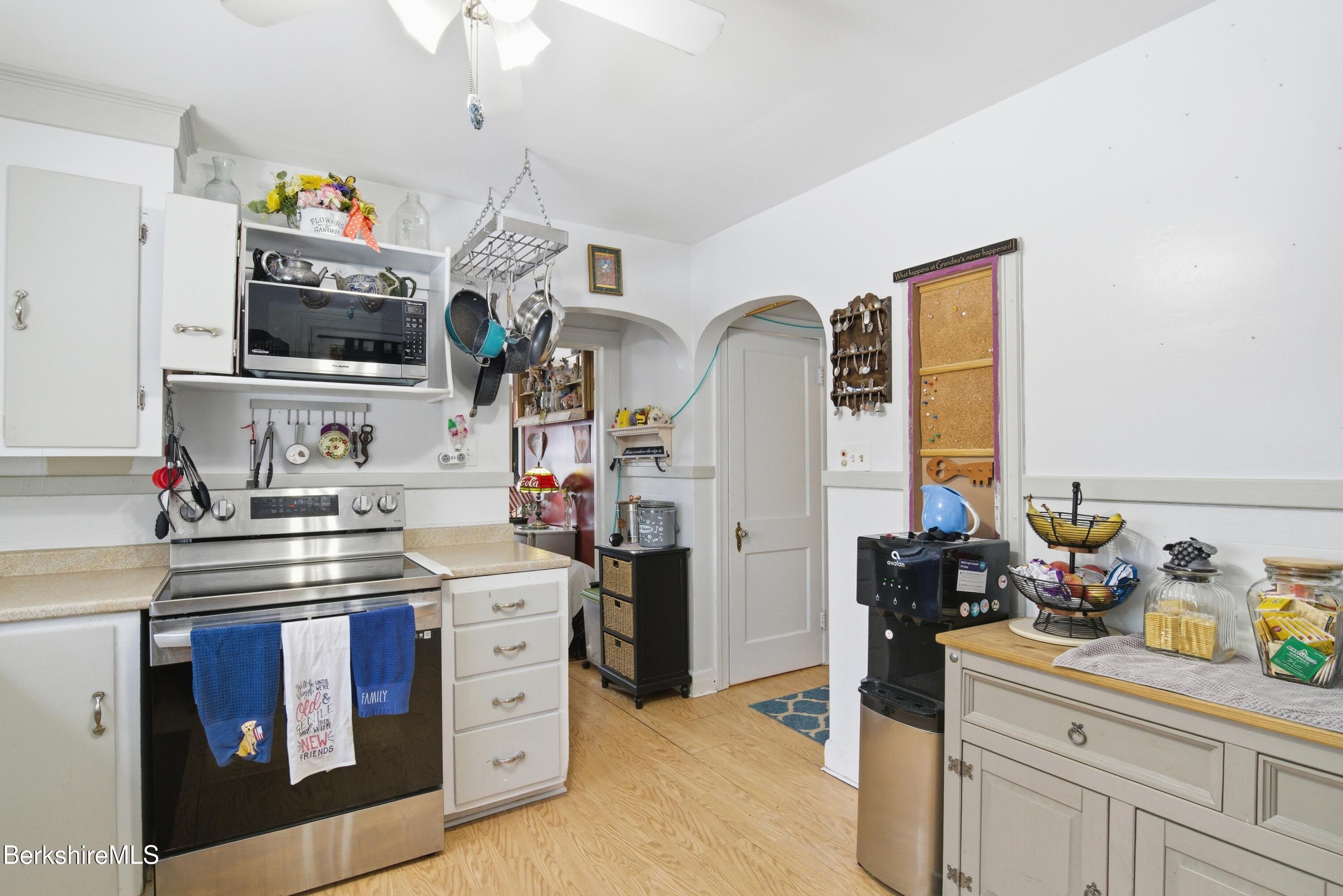 53 Edison Avenue Pittsfield, MA 01201 - Photo 15 of 45 a kitchen with stainless steel appliances a stove a sink and a refrigerator