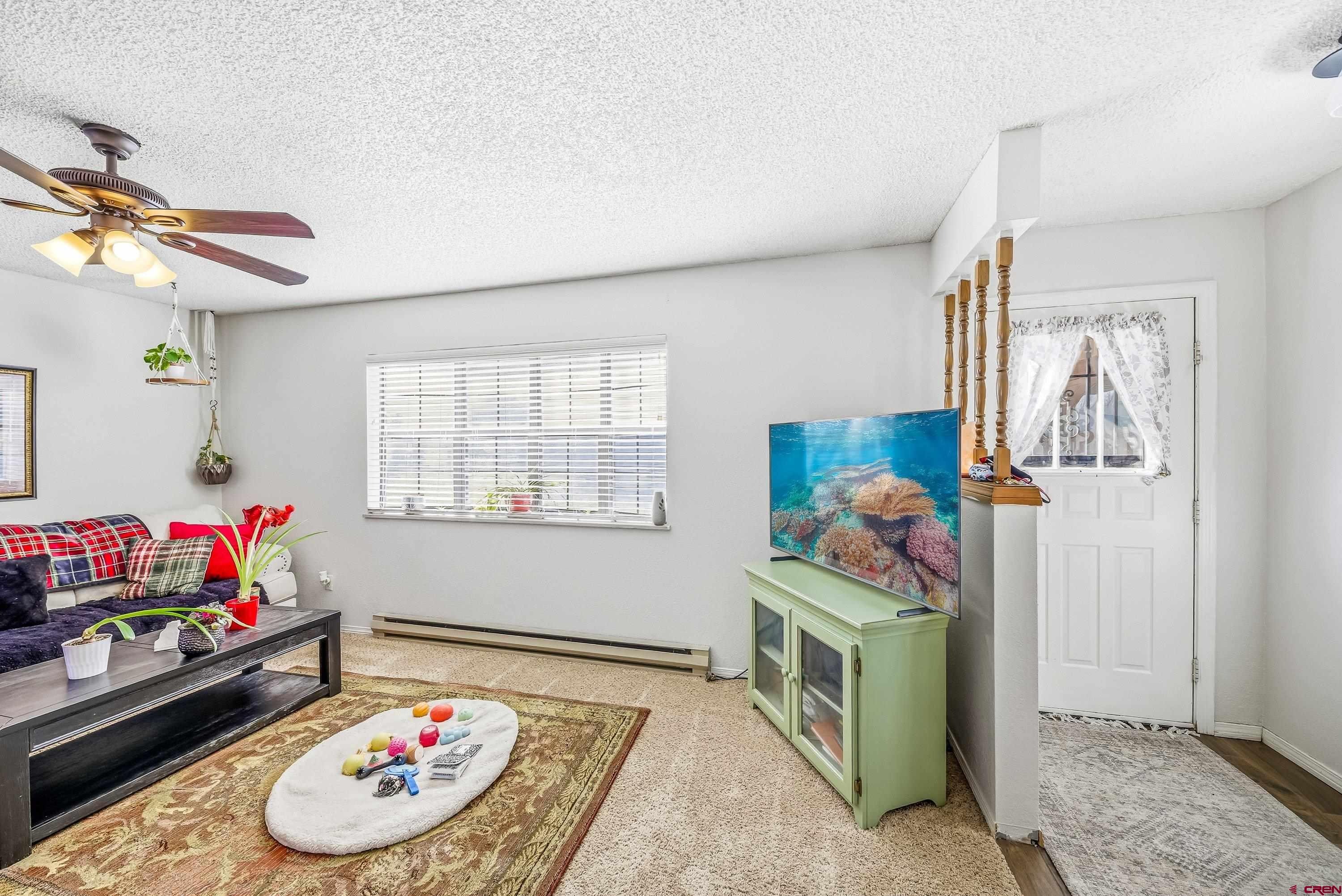 155 East 7th Street Delta, CO 81416 - Photo 2 of 19 a room with toys and a wooden floor