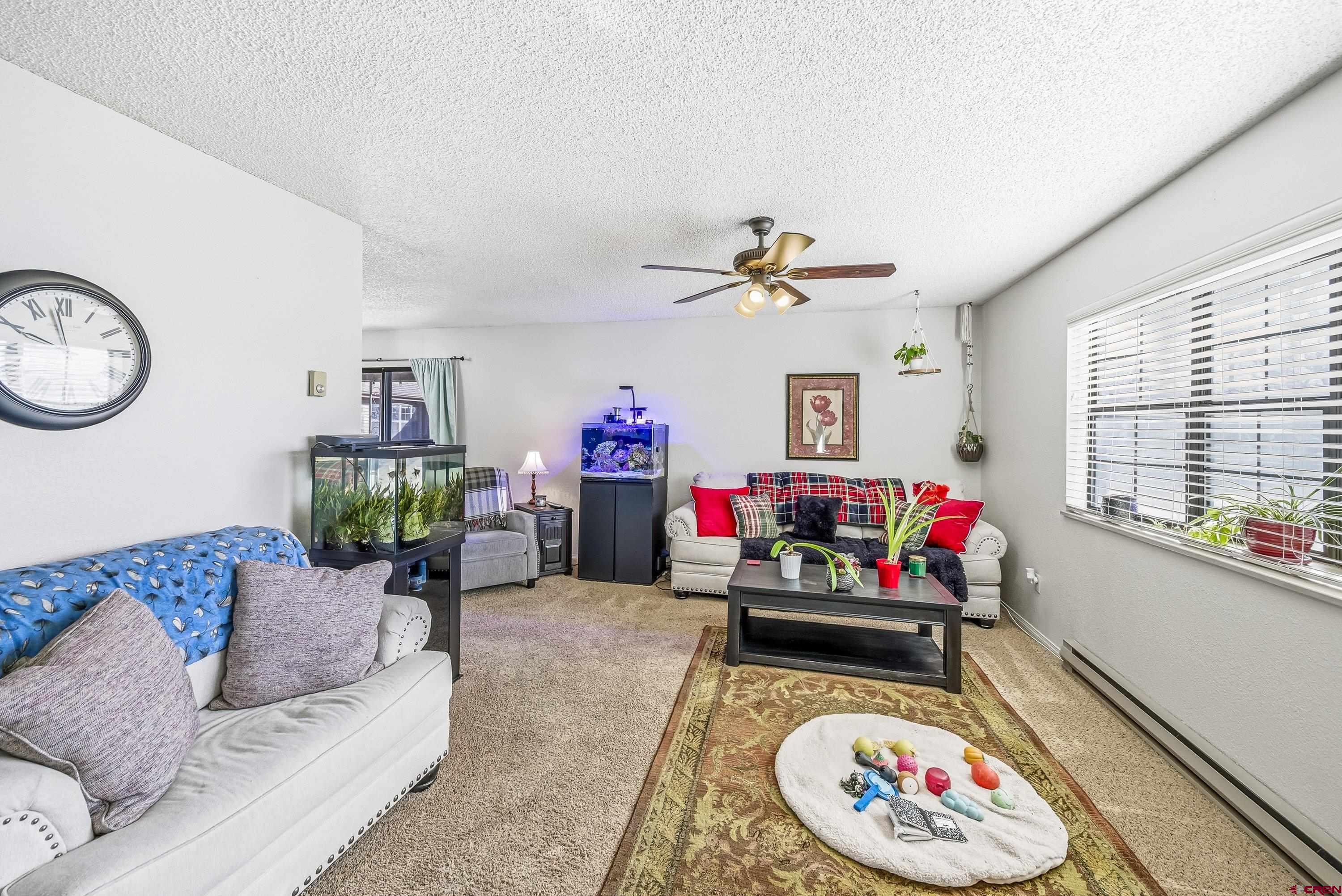 155 East 7th Street Delta, CO 81416 - Photo 3 of 19 a living room with furniture and a window