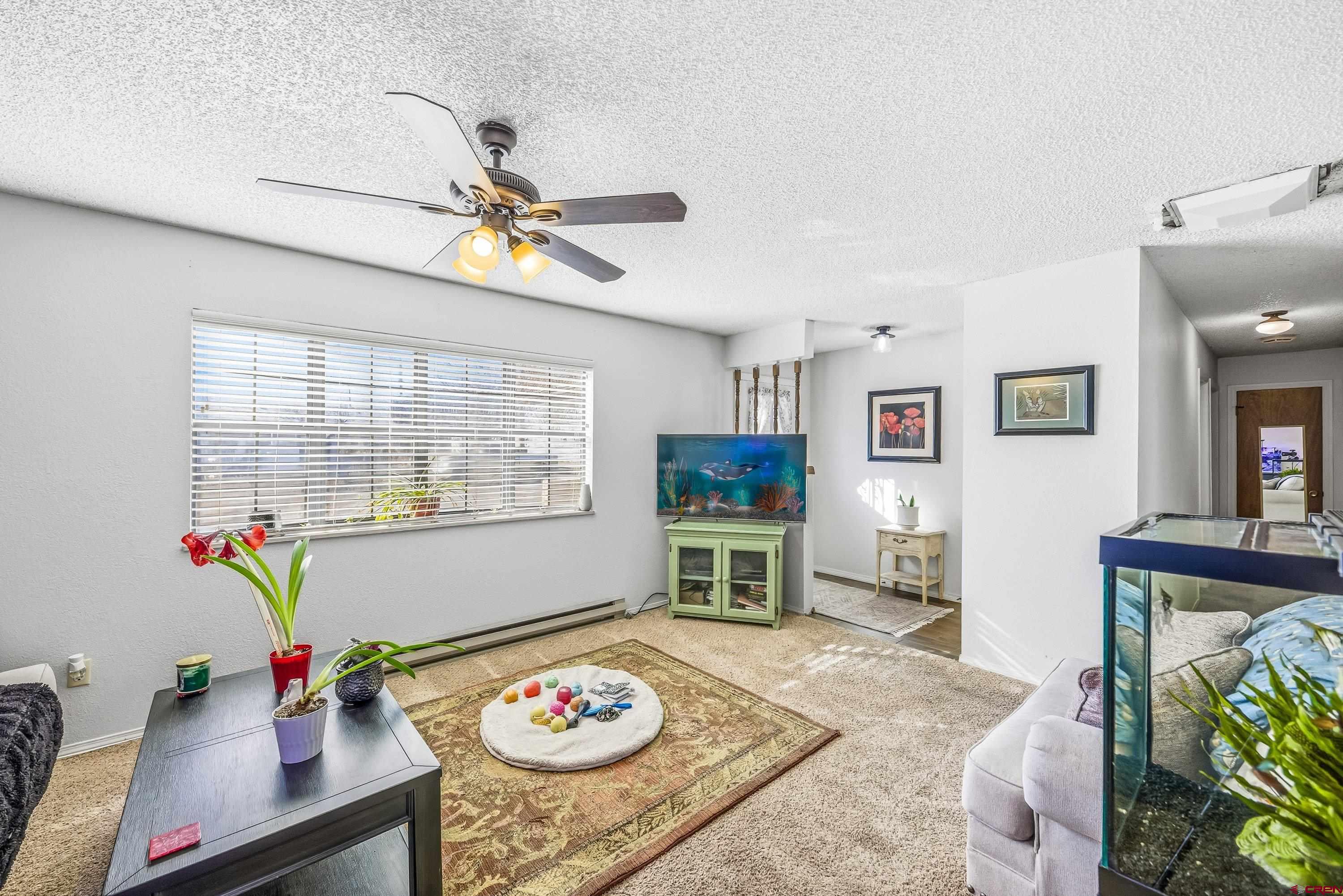 155 East 7th Street Delta, CO 81416 - Photo 5 of 19 a living room with furniture and a window