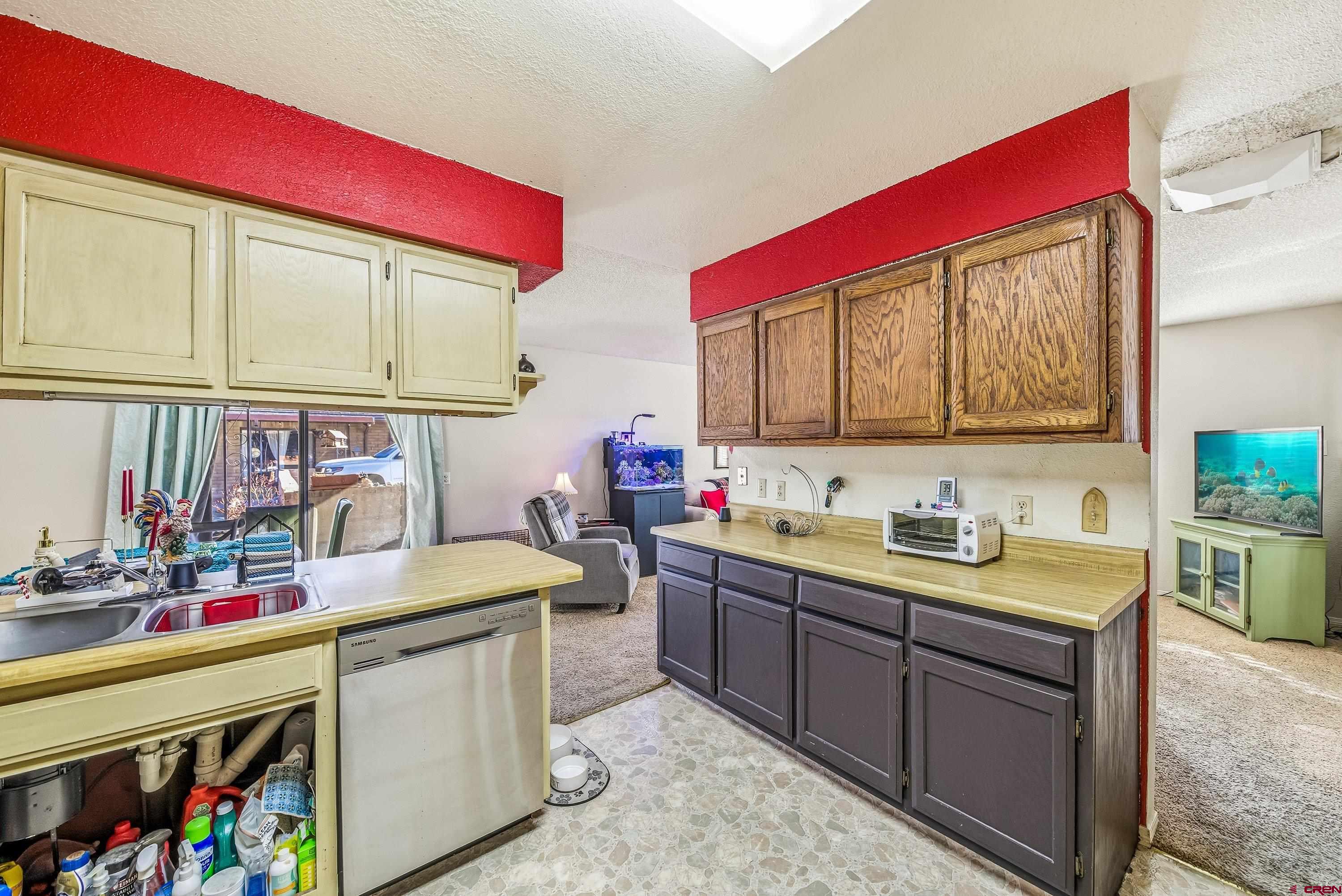 155 East 7th Street Delta, CO 81416 - Photo 8 of 19 a kitchen that has a sink and a stove in it