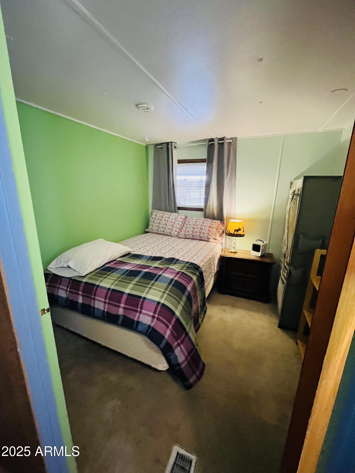 2100 North Trekell Road, Unit 17 Casa Grande, AZ 85122 - Photo 12 of 25 a bedroom with a bed and dresser