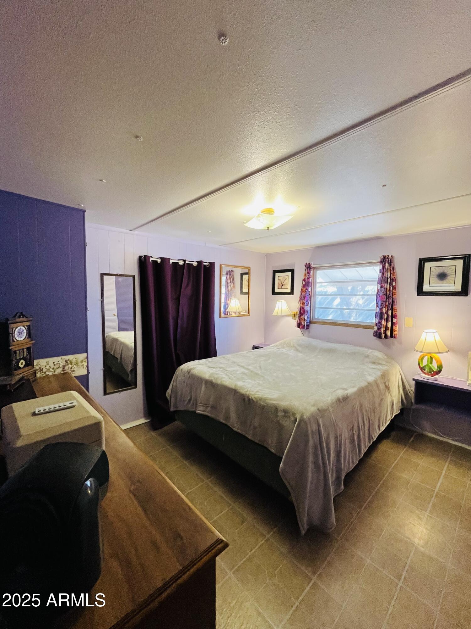 2100 North Trekell Road, Unit 17 Casa Grande, AZ 85122 - Photo 17 of 25 a spacious bedroom with a bed and a dresser