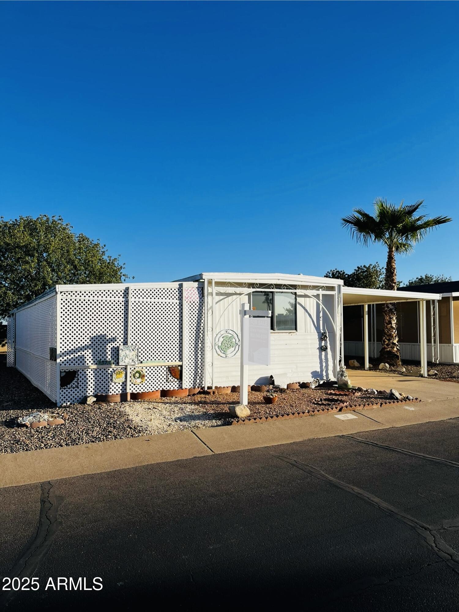 2100 North Trekell Road, Unit 17 Casa Grande, AZ 85122 - Photo 3 of 25 a front view of a house with a road