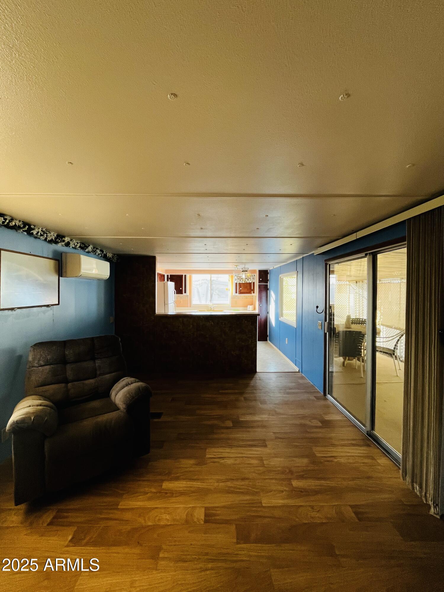 2100 North Trekell Road, Unit 17 Casa Grande, AZ 85122 - Photo 7 of 25 a living room with furniture and a flat screen tv