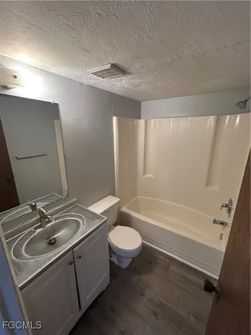 a bathroom with a sink a toilet and a bathtub