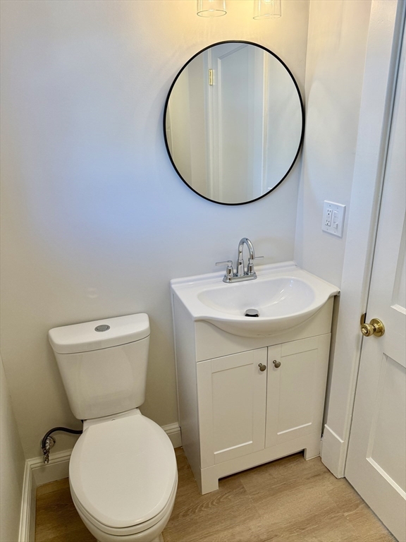 424 Chapin Street Ludlow, MA 01056 - Photo 15 of 32 a bathroom with a sink a toilet and mirror