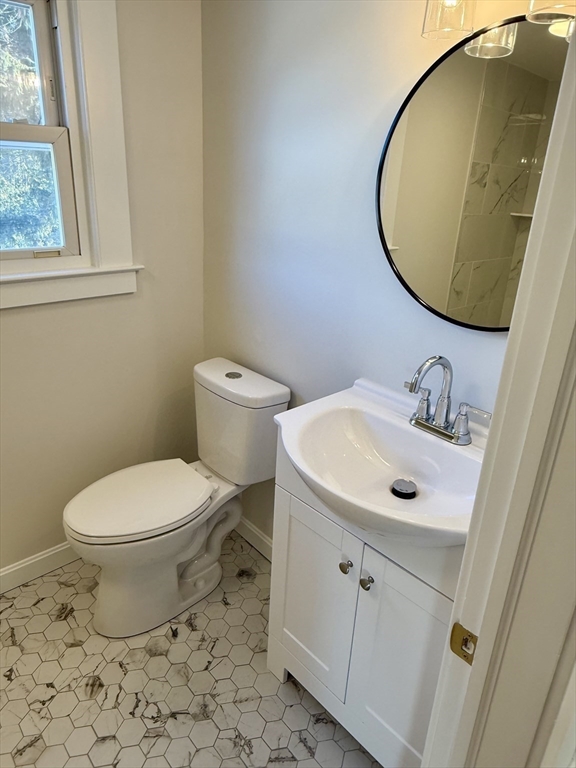 424 Chapin Street Ludlow, MA 01056 - Photo 20 of 32 a bathroom with a sink and a mirror
