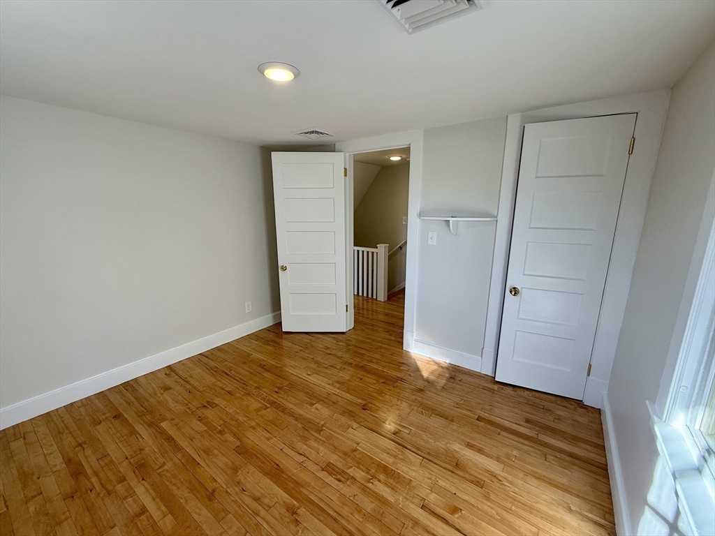 424 Chapin Street Ludlow, MA 01056 - Photo 24 of 32 a view of an empty room and wooden floor