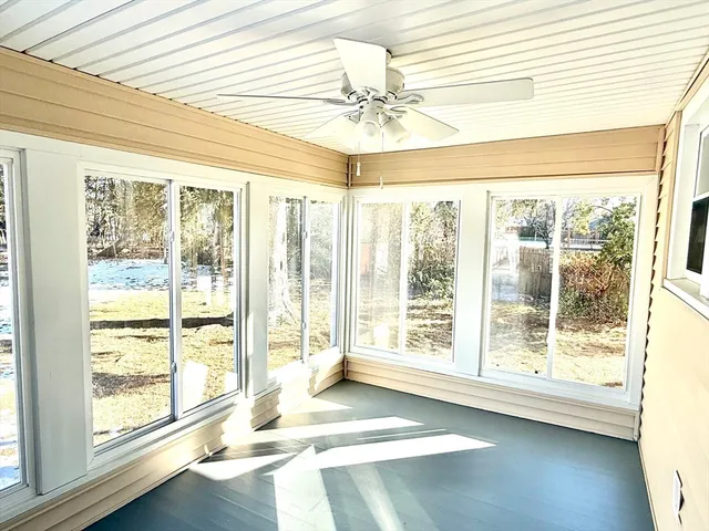 a view of an empty room and a window