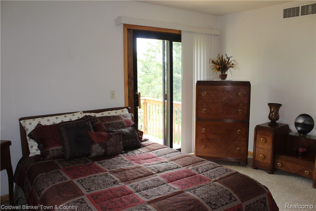 11882 Knob Hill Road Brighton, MI 48114 - Photo 19 of 41 Master bedroom with doorwall to private balcony