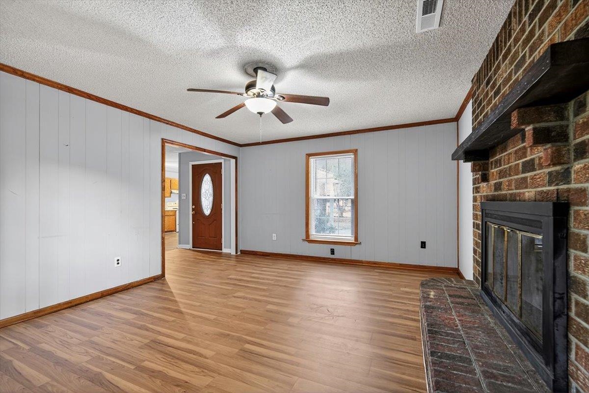 2137 North N Highway Bonneau, SC 29431 - Photo 7 of 19 16'6"x12'6" with ceiling fan and brick fireplace