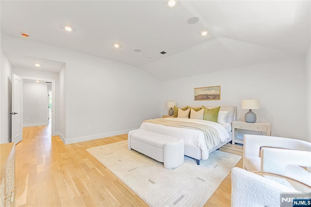 429 Riverside Avenue Rutherford, NJ 07070 - Photo 17 of 32 a spacious bedroom with a bed and a couch