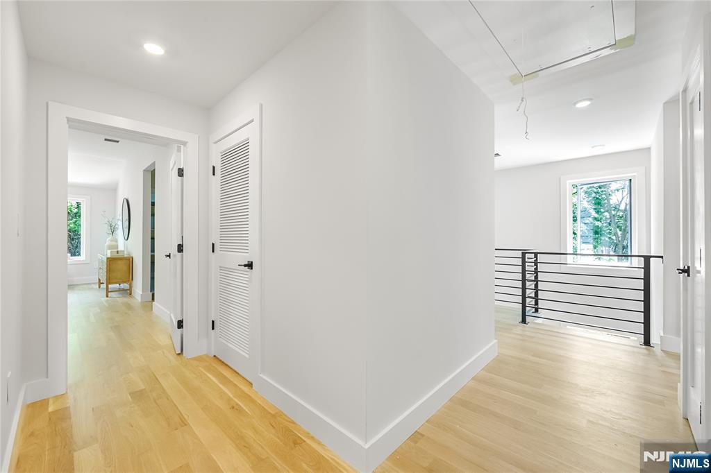 429 Riverside Avenue Rutherford, NJ 07070 - Photo 25 of 32 wooden floor in a hall with an entryway
