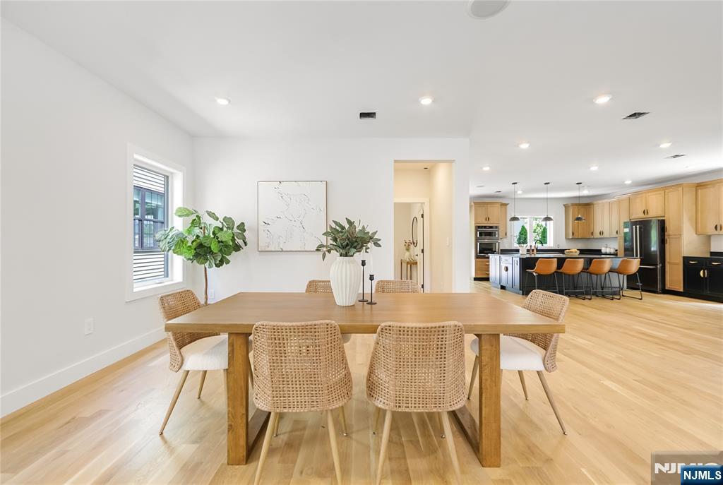 429 Riverside Avenue Rutherford, NJ 07070 - Photo 5 of 32 a view of a dining room with furniture and a potted plant