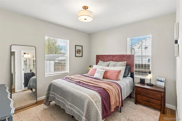 a bedroom with a bed and a couch