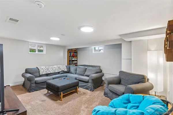 a living room with furniture and a couch
