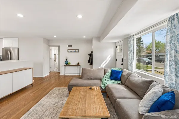 a living room with furniture and a large window