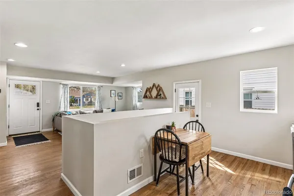 a living room with furniture and a table