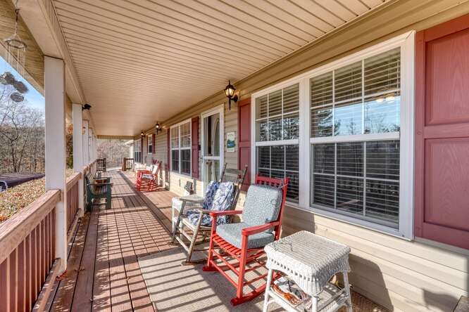 756 Doc Jones Road Blairsville, GA 30512 - Photo 19 of 46 a balcony with furniture and a potted plant