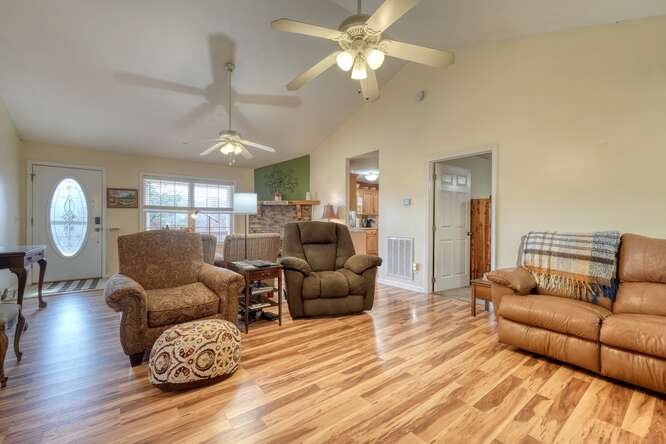 756 Doc Jones Road Blairsville, GA 30512 - Photo 23 of 46 a living room with furniture and a wooden floor