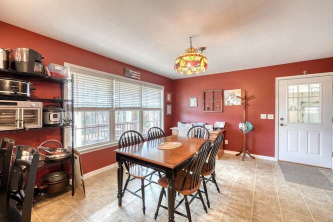 756 Doc Jones Road Blairsville, GA 30512 - Photo 28 of 46 a view of a dining room with furniture and chandelier