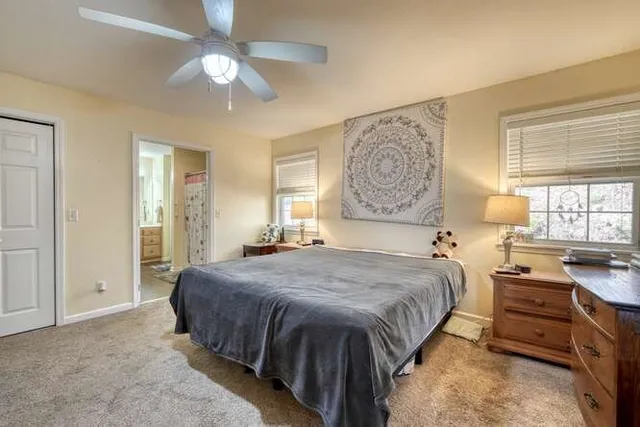 a bathroom with a mirror a bathtub and shower