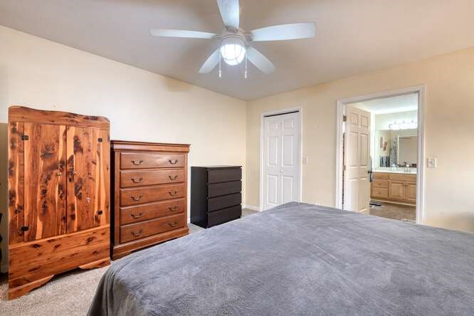 756 Doc Jones Road Blairsville, GA 30512 - Photo 32 of 46 a bedroom with a bed and a chandelier