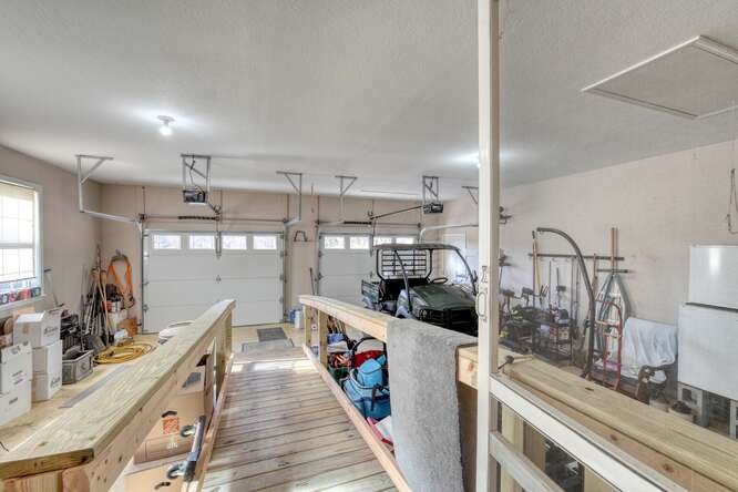 756 Doc Jones Road Blairsville, GA 30512 - Photo 42 of 46 a kitchen with stainless steel appliances kitchen island wooden cabinets and granite counter tops