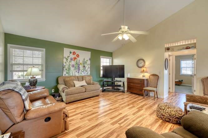 756 Doc Jones Road Blairsville, GA 30512 - Photo 5 of 46 a living room with furniture a fireplace and a flat screen tv