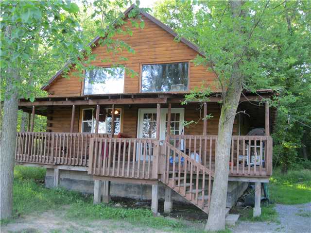 13841 Gillette Road Albion, NY 14411 - Photo 1 of 1 Exterior Front Great log cabin with full wrap arou