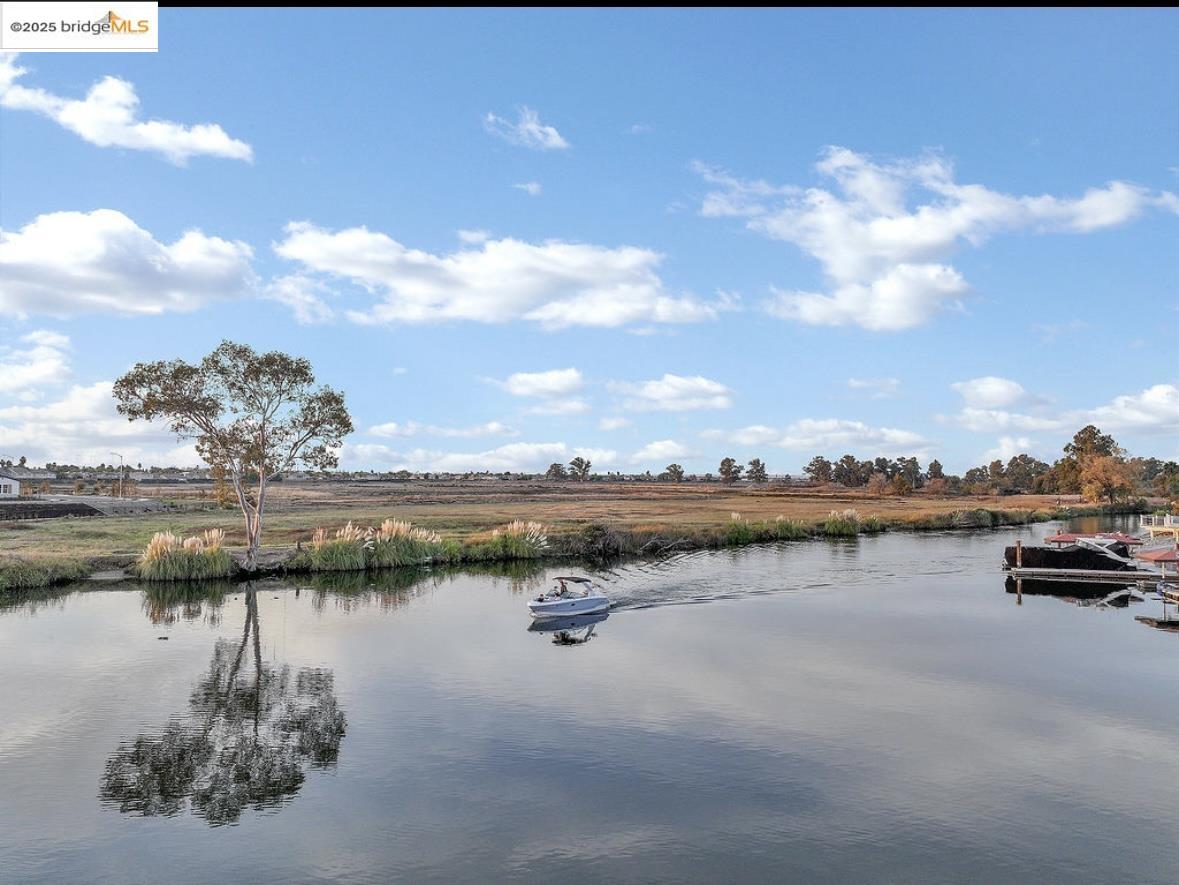 4930 Discovery Point Discovery Bay, CA 94505 - Photo 25 of 30 a view of a lake with houses in the back