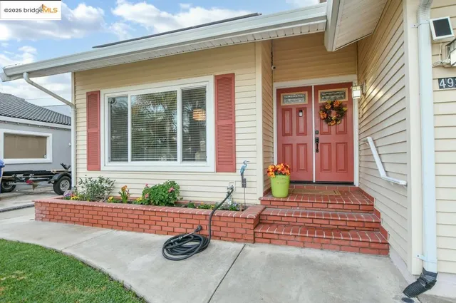 a front view of a house with patio