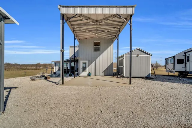 a view of a house with ocean from a terrace