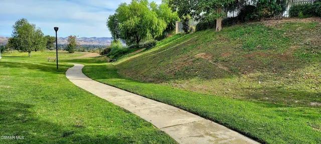 a view of a swimming pool with a balcony