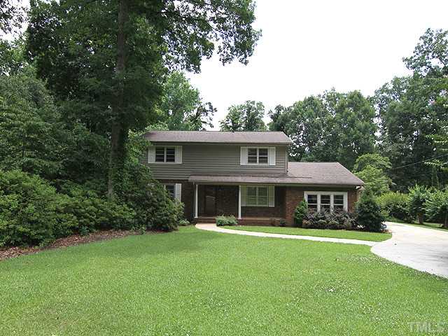 1309 Kingston Ridge Road Cary, NC 27511 - Photo 3 of 18 Lush front yard with level drive and roundabout to right for turning around.