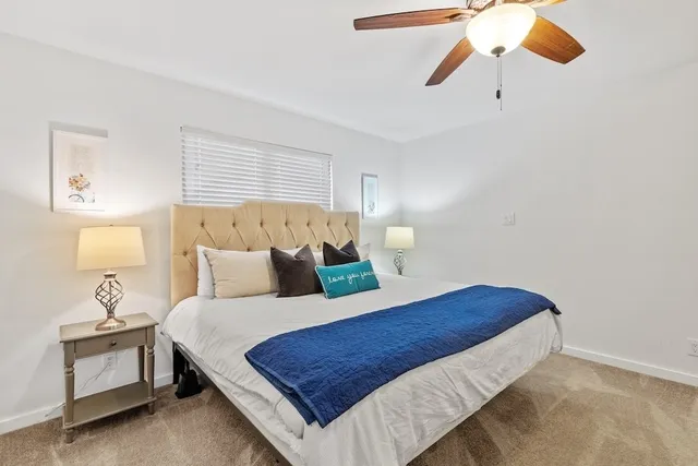 a bedroom with a bed and window