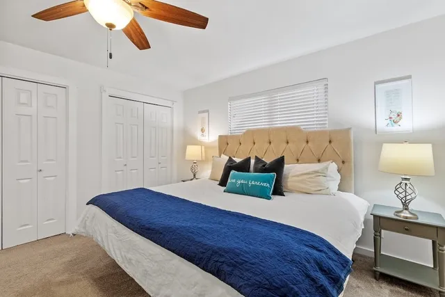 a bedroom with bed and window