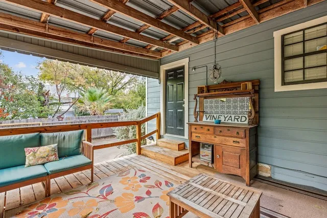 a reading room with furniture and a rug