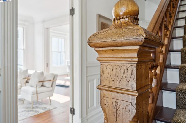 a living room with furniture potted plant a fireplace and a window