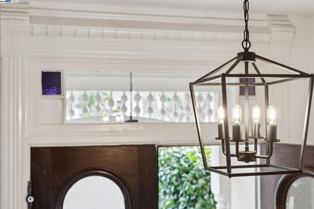 a living room with furniture a fireplace and a large window