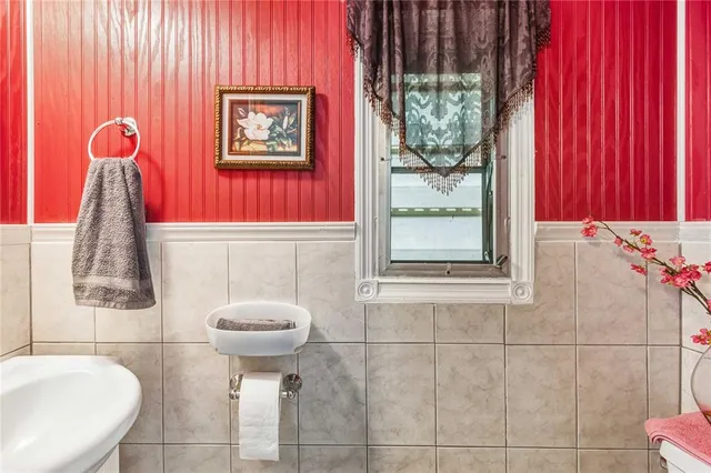 a hallway with furniture and wooden floor