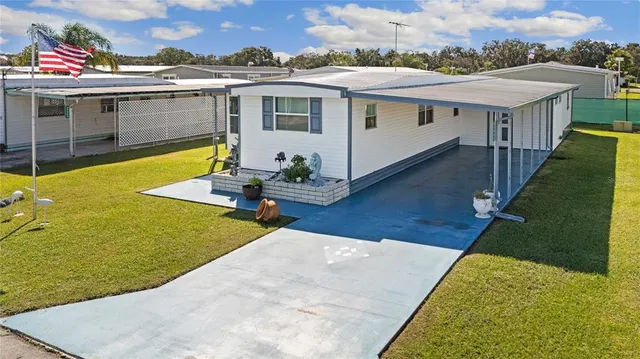 a aerial view of a house with swimming pool