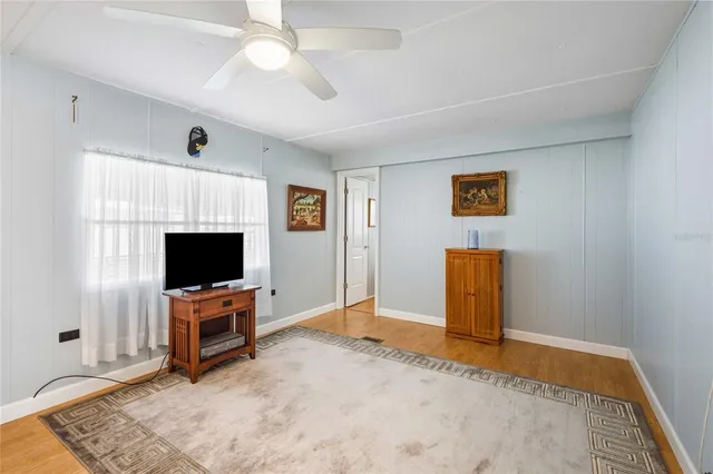 a view of livingroom with flat screen tv and washer