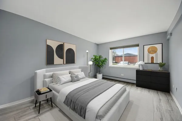 a bedroom with a large bed and a dresser