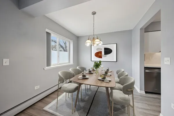 a view of a dining room with furniture window and wooden floor