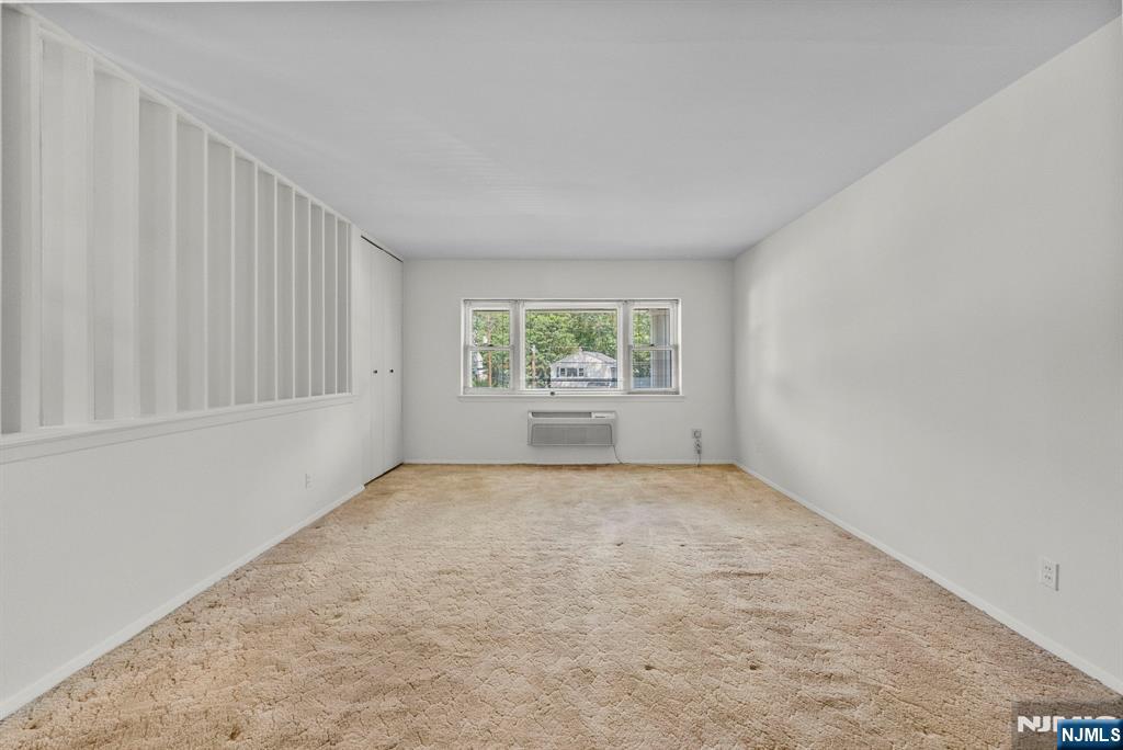54 Westervelt Avenue, Unit B Tenafly, NJ 07670 - Photo 6 of 17 an empty room with windows