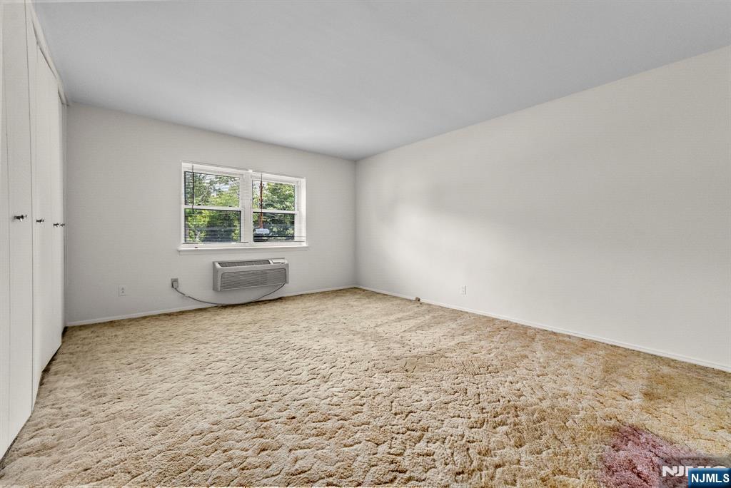 54 Westervelt Avenue, Unit B Tenafly, NJ 07670 - Photo 7 of 17 an empty room with a window